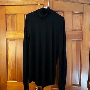 Lululemon Black long sleeve Turtleneck. Size 12. Thumb holes. Super comfy.